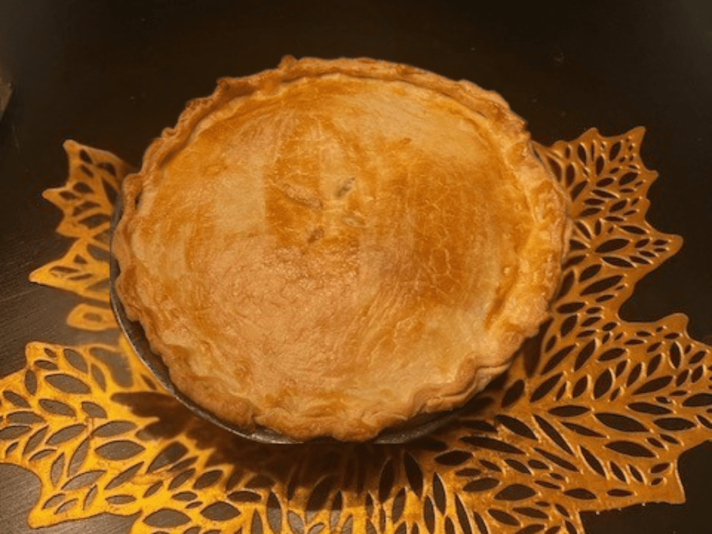 Homemade turkey pot pie with flaky golden crust and creamy turkey and vegetable filling