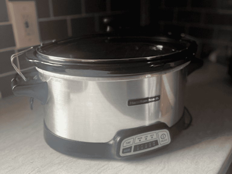 Hamilton Beach 7-quart programmable slow cooker with a silver finish and removable crock.