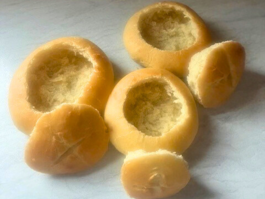 Homemade bread bowls ready to be filled with creamy soup