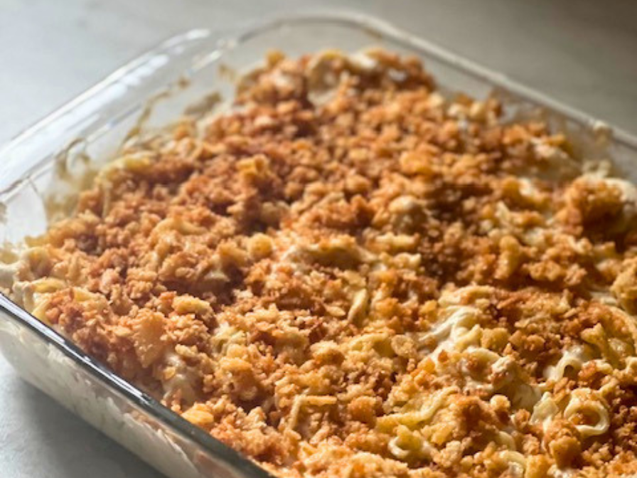 Chicken noodle casserole with a golden buttery Ritz cracker topping baked in a casserole dish