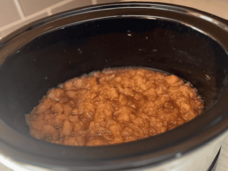 Homemade cinnamon applesauce finished and ready to serve in a slow cooker.